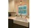Kitchen sink with white countertops and industrial hanging light at 3478 Grant Nw Dr, Kennesaw, GA 30144