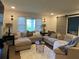 Cozy living room area featuring a large sectional sofa and stylish decor at 3478 Grant Nw Dr, Kennesaw, GA 30144