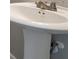 Close-up of a white pedestal sink and faucet in a bathroom at 402 Whippet St, Union City, GA 30291
