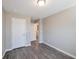 A spacious bedroom with light grey walls and gray wood-look floors and white doors at 402 Whippet St, Union City, GA 30291