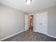 Bright bedroom offers gray flooring, complemented by closet and light grey walls at 402 Whippet St, Union City, GA 30291