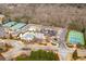 Aerial view of the community's recreation area featuring tennis courts, a pool, and a playground at 510 Pinchot Way, Woodstock, GA 30188