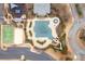 Aerial view of community pool with beach volleyball, a playground, parking lot and green space at 510 Pinchot Way, Woodstock, GA 30188