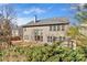 View of the back of the gray home showcasing lots of windows and grassy backyard at 510 Pinchot Way, Woodstock, GA 30188