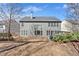 Backyard featuring a gray-sided house with lots of windows and the grassy backyard at 510 Pinchot Way, Woodstock, GA 30188