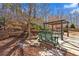 Backyard patio and pergola with outdoor seating in a grassy backyard at 510 Pinchot Way, Woodstock, GA 30188