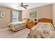 Bedroom with two twin beds, ceiling fan and window with curtains at 510 Pinchot Way, Woodstock, GA 30188