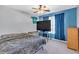 Cozy bedroom with blue walls, a ceiling fan, and a comfortable bed at 510 Pinchot Way, Woodstock, GA 30188