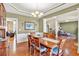 Elegant dining room with tray ceiling, perfect for entertaining guests at 510 Pinchot Way, Woodstock, GA 30188