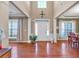Open foyer with hardwood floors, complemented by elegant lighting and décor at 510 Pinchot Way, Woodstock, GA 30188