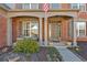 Inviting front porch with seating and tasteful landscaping, perfect for relaxing outdoors at 510 Pinchot Way, Woodstock, GA 30188