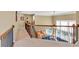Hallway with wooden railings overlooking the living room on the main floor at 510 Pinchot Way, Woodstock, GA 30188