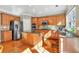 Modern kitchen with wooden cabinets, stainless steel appliances, granite countertops, and ample natural light at 510 Pinchot Way, Woodstock, GA 30188
