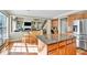 Kitchen with center island featuring stainless steel appliances and an open view of the living room at 510 Pinchot Way, Woodstock, GA 30188