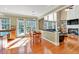 Open concept kitchen and living space with hardwood floors, an island, and plenty of sunlight at 510 Pinchot Way, Woodstock, GA 30188