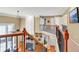 This landing features hardwood floors, iron spindles, and custom built-in shelves at 510 Pinchot Way, Woodstock, GA 30188