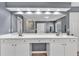 This primary bathroom features a double sink vanity with lots of storage and modern lighting at 510 Pinchot Way, Woodstock, GA 30188