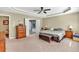 This primary bedroom boasts a tray ceiling, ceiling fan, and ensuite bathroom at 510 Pinchot Way, Woodstock, GA 30188