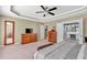 Large main bedroom boasts an ensuite bathroom and a tray ceiling with a ceiling fan at 510 Pinchot Way, Woodstock, GA 30188