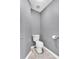 This half bathroom features a neutral color palette and classic fixtures at 510 Pinchot Way, Woodstock, GA 30188