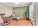Cozy sitting room with natural light, perfect for reading or relaxing at 510 Pinchot Way, Woodstock, GA 30188