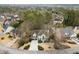 Aerial view of a home with a well-manicured front yard and a two-car garage in a lush neighborhood at 6268 Braidwood Nw Run, Acworth, GA 30101
