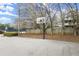 Community basketball court near parking and tennis courts for residents' recreational use at 6268 Braidwood Nw Run, Acworth, GA 30101
