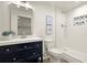 Stylish bathroom featuring a new vanity, framed mirror, and a tiled shower with built-in niche at 6268 Braidwood Nw Run, Acworth, GA 30101