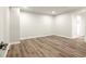 Bedroom featuring new floors, neutral walls, and an entrance to an additional room at 6268 Braidwood Nw Run, Acworth, GA 30101