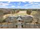 Stately clubhouse with manicured landscaping and convenient golf cart parking at 6268 Braidwood Nw Run, Acworth, GA 30101