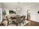 Formal dining room boasts elegant decor, lighting, and an open floor plan at 6268 Braidwood Nw Run, Acworth, GA 30101