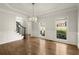 Grand foyer with hardwood floors, staircase, and natural light streaming in at 6268 Braidwood Nw Run, Acworth, GA 30101