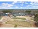 Expansive golf course and clubhouse nestled within a picturesque landscape at 6268 Braidwood Nw Run, Acworth, GA 30101