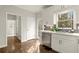 Bright kitchen featuring stainless steel appliances, white cabinets and countertops, and a pantry at 6268 Braidwood Nw Run, Acworth, GA 30101