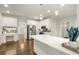 Bright kitchen featuring stainless steel appliances, an island, white countertops, and built in desk at 6268 Braidwood Nw Run, Acworth, GA 30101