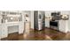Bright kitchen featuring stainless steel appliances, built in desk area, and stylish backsplash at 6268 Braidwood Nw Run, Acworth, GA 30101