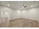 Open-concept living room with hardwood floors, ceiling fan and recessed lighting at 6268 Braidwood Nw Run, Acworth, GA 30101