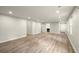 Bright living room featuring recessed lighting, new floors, and neutral walls at 6268 Braidwood Nw Run, Acworth, GA 30101