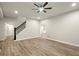 Large living room featuring hardwood floors, recessed lighting, and a staircase at 6268 Braidwood Nw Run, Acworth, GA 30101