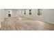 Open living room featuring hardwood floors, recessed lighting, and multiple windows at 6268 Braidwood Nw Run, Acworth, GA 30101