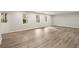 Spacious living room with hardwood floors, recessed lighting, and multiple windows at 6268 Braidwood Nw Run, Acworth, GA 30101