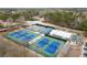 Aerial view of the tennis courts and community facilities offering recreational activities for residents at 6268 Braidwood Nw Run, Acworth, GA 30101