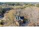 Aerial view of a home nestled in a tree-filled landscape at 650 Vinings Estates Se Dr, Mableton, GA 30126