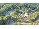 Scenic aerial view of community amenities including tennis courts and a large pool area at 650 Vinings Estates Se Dr, Mableton, GA 30126