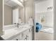 Bathroom with a modern sink, vanity, and a view into the bedroom at 650 Vinings Estates Se Dr, Mableton, GA 30126