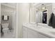 Bright bathroom featuring modern fixtures and access to the walk-in closet at 650 Vinings Estates Se Dr, Mableton, GA 30126