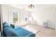 Bright bedroom with large windows, shutters, and a comfortable sitting area at 650 Vinings Estates Se Dr, Mableton, GA 30126