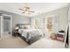 Comfortable bedroom featuring a bed, neutral color scheme, and natural light at 650 Vinings Estates Se Dr, Mableton, GA 30126