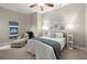 Comfortable bedroom with soothing decor, a ceiling fan, and a cozy chaise lounge for relaxing in style at 650 Vinings Estates Se Dr, Mableton, GA 30126