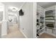 Organized closet with built-in shelving and ample space for clothing storage at 650 Vinings Estates Se Dr, Mableton, GA 30126